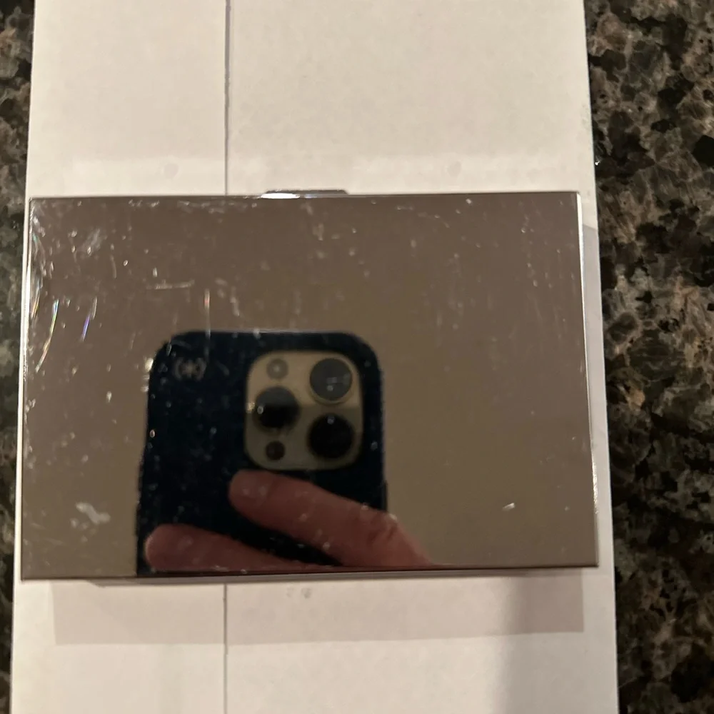 Calculator/card case.  Gently pre-owned.  Note some scratches on back.
